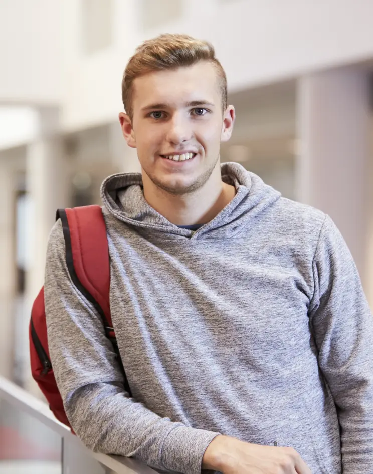 College guy currying bags