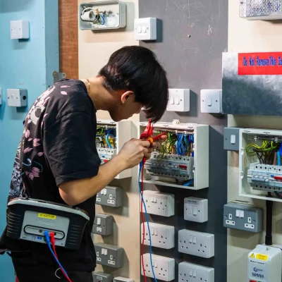 a male electrical student in workshop